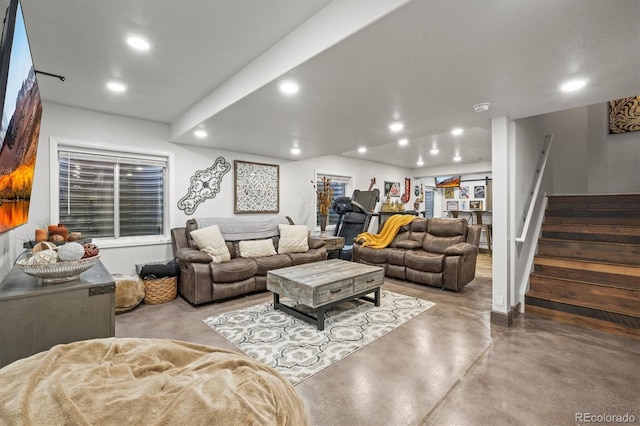 living area featuring stairs, concrete floors, and recessed lighting