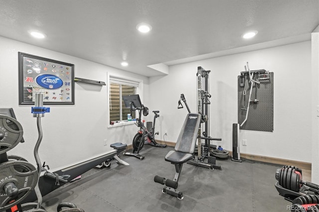 exercise room featuring recessed lighting and baseboards