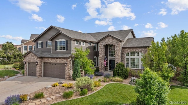 7408 Sodalite Way, Castle Rock, CO 80108 - view of front of property with an attached garage, concrete driveway, a front lawn, roof with shingles, and brick siding
