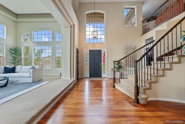 7408 Sodalite Way, Castle Rock, CO 80108 - foyer entrance with a high ceiling, healthy amount of natural light, and baseboards