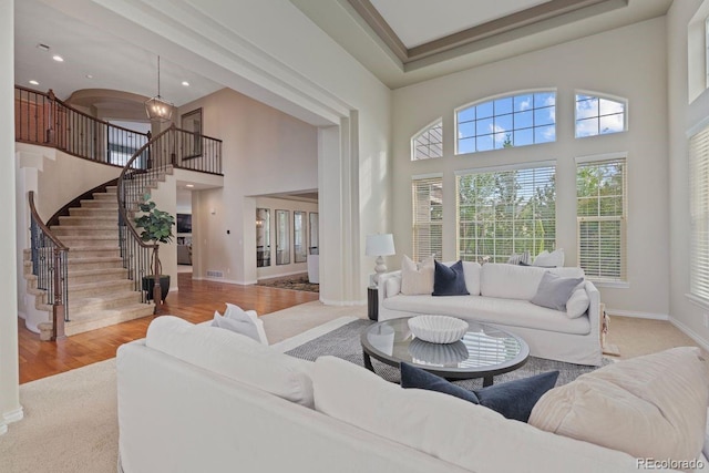 7408 Sodalite Way, Castle Rock, CO 80108 - living room with a towering ceiling, stairway, wood finished floors, baseboards, and recessed lighting