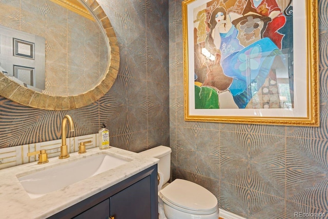 7408 Sodalite Way, Castle Rock, CO 80108 - bathroom with wallpapered walls, toilet, and vanity