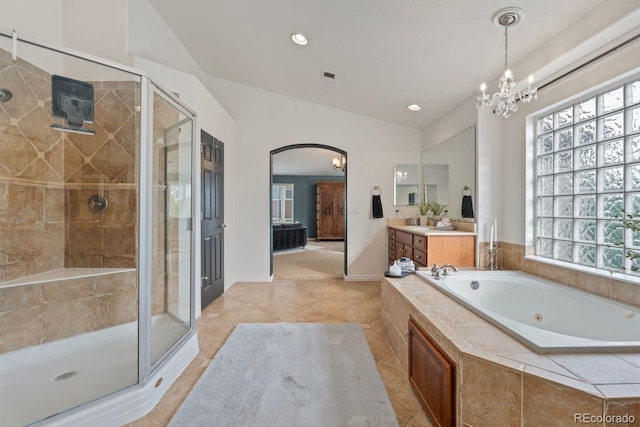 7408 Sodalite Way, Castle Rock, CO 80108 - bathroom with vanity, a whirlpool tub, a stall shower, a chandelier, and healthy amount of natural light