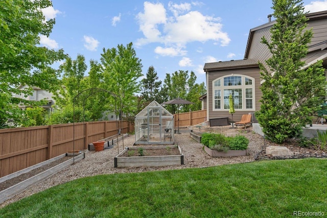 7408 Sodalite Way, Castle Rock, CO 80108 - view of yard with a vegetable garden, an exterior structure, and an outdoor structure