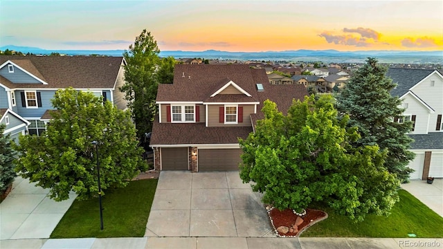 23060 Hope Dale Ave, Parker, CO 80138 - view of front of house featuring concrete driveway, an attached garage, a residential view, roof with shingles, and brick siding