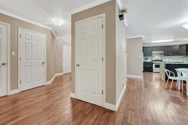 123 Wheat Ridge St, Palmer Lake, CO 80133 - hall with crown molding and wood finished floors