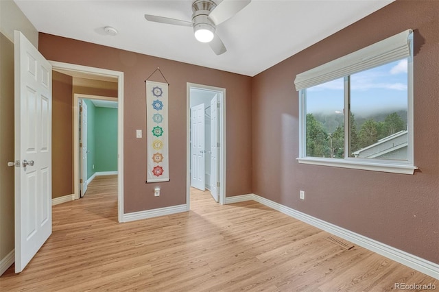 123 Wheat Ridge St, Palmer Lake, CO 80133 - empty room featuring light wood-style floors and a ceiling fan