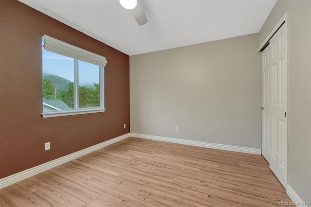 123 Wheat Ridge St, Palmer Lake, CO 80133 - unfurnished bedroom featuring light wood finished floors, a closet, and ceiling fan