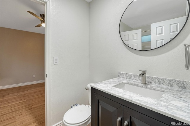 123 Wheat Ridge St, Palmer Lake, CO 80133 - bathroom featuring vanity, a ceiling fan, and wood finished floors