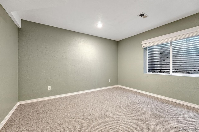 123 Wheat Ridge St, Palmer Lake, CO 80133 - carpeted empty room featuring baseboards and a textured wall