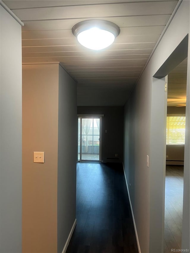 665 S Clinton St Unit 14A, Denver, CO 80247 - corridor with dark wood finished floors, baseboards, and baseboard heating