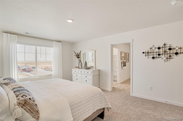 bedroom featuring light colored carpet