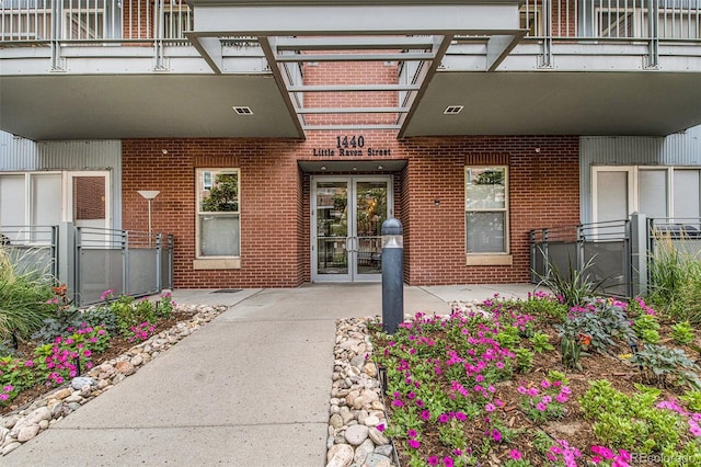 1440 Little Raven St Unit 202, Denver, CO 80202 - doorway to property with brick siding