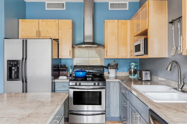 1440 Little Raven St Unit 202, Denver, CO 80202 - kitchen with appliances with stainless steel finishes, a sink, light brown cabinetry, and wall chimney exhaust hood