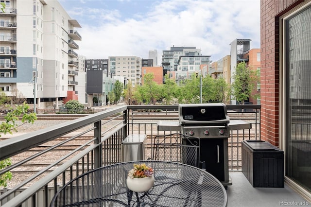 1440 Little Raven St Unit 202, Denver, CO 80202 - balcony featuring area for grilling and outdoor dining area