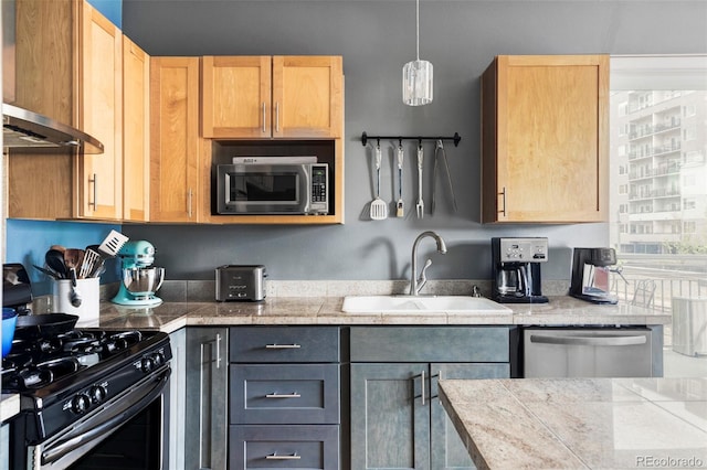 1440 Little Raven St Unit 202, Denver, CO 80202 - kitchen featuring appliances with stainless steel finishes, a sink, tile counters, and light brown cabinetry