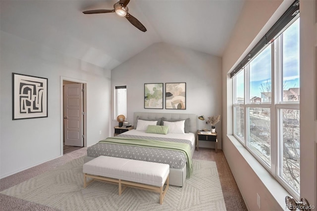 bedroom featuring ceiling fan, carpet, multiple windows, and lofted ceiling