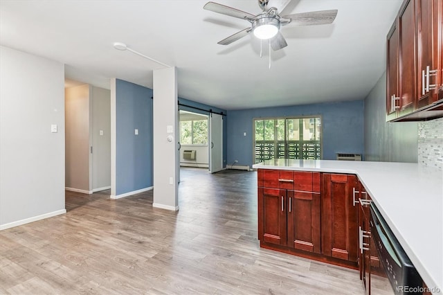 595 S Alton Way Unit 7B, Denver, CO 80247 - kitchen with dishwashing machine, a peninsula, light countertops, ceiling fan, and light wood finished floors