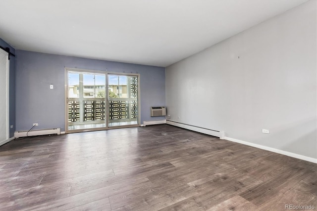 595 S Alton Way Unit 7B, Denver, CO 80247 - empty room with baseboard heating, a baseboard radiator, a barn door, wood finished floors, and a wall mounted AC