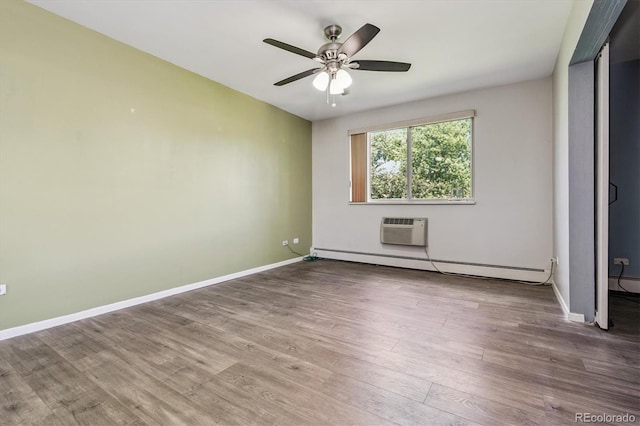595 S Alton Way Unit 7B, Denver, CO 80247 - unfurnished bedroom with a baseboard heating unit, wood finished floors, ceiling fan, and a wall mounted AC