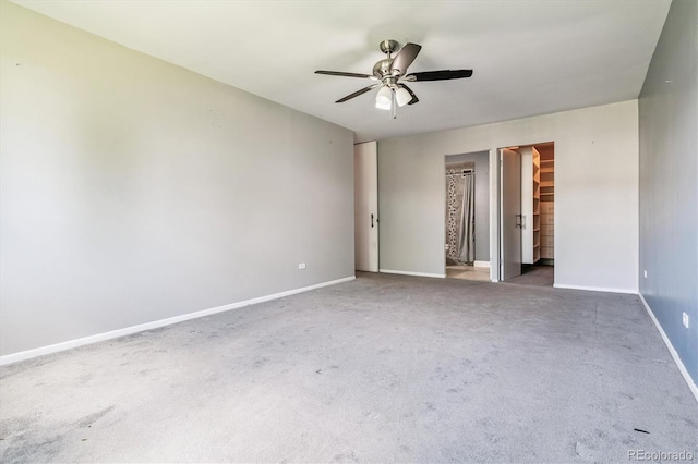 595 S Alton Way Unit 7B, Denver, CO 80247 - carpeted empty room featuring a ceiling fan and baseboards