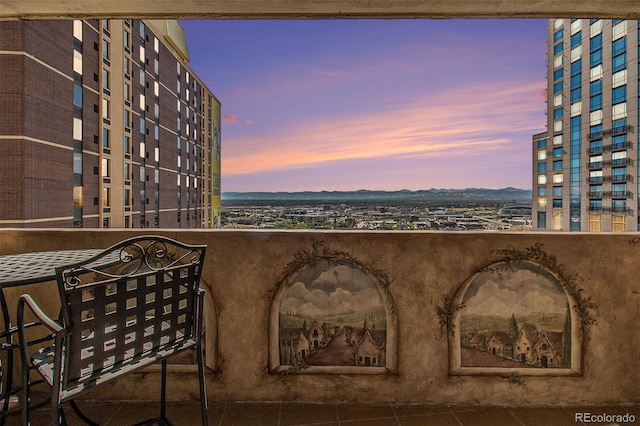 view of balcony at dusk