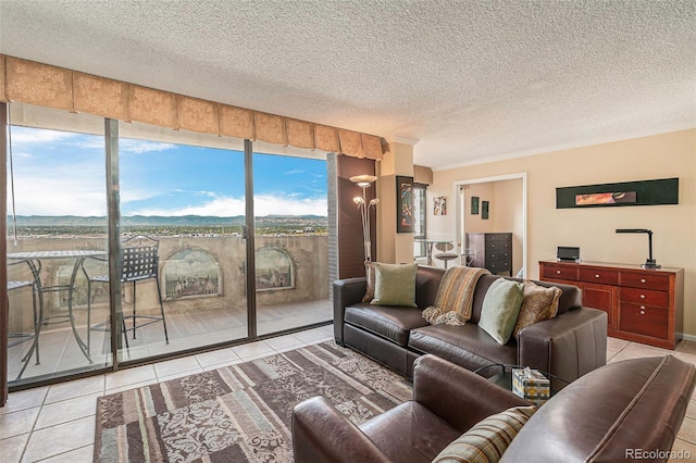 living room with ornamental molding, a textured ceiling, and light tile patterned floors