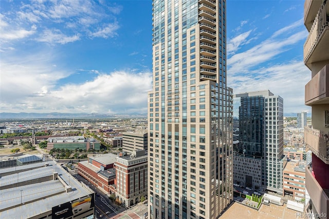 property's view of city with a mountain view