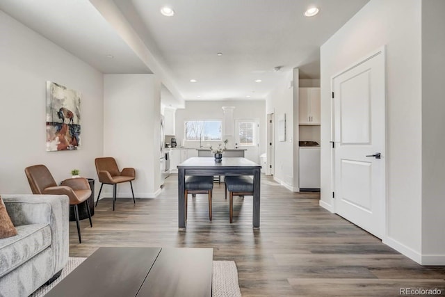 dining area with dark hardwood / wood-style floors