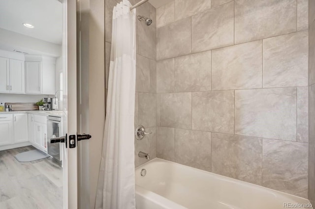 bathroom with shower / tub combo and vanity