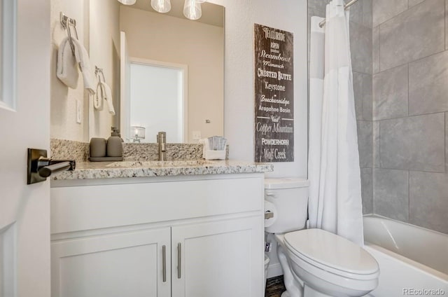 full bathroom with toilet, vanity, and shower / bath combo with shower curtain