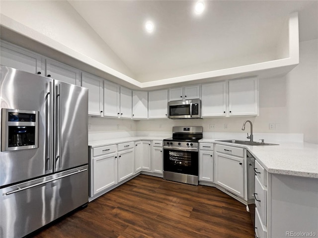 kitchen featuring white cabinets, stainless steel appliances, dark hardwood / wood-style flooring, and sink