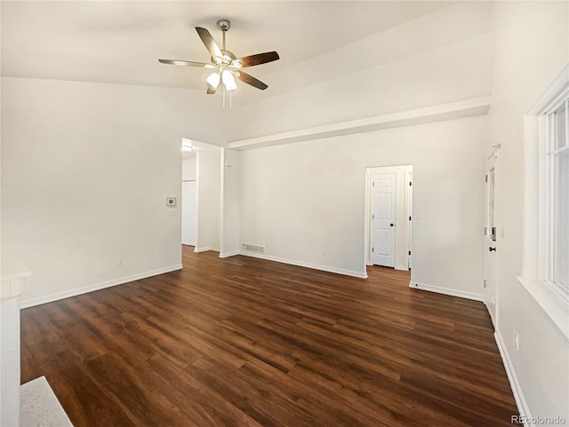 interior space featuring dark wood-type flooring, vaulted ceiling, and ceiling fan