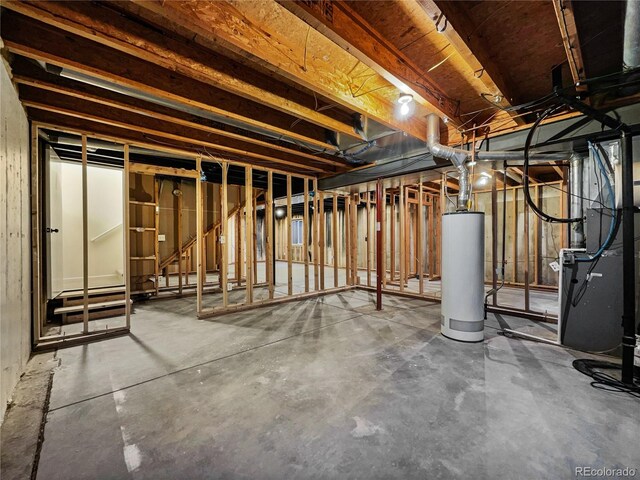 basement with gas water heater and heating unit