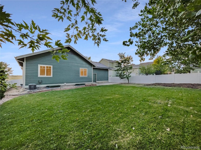 view of yard featuring cooling unit and a patio area