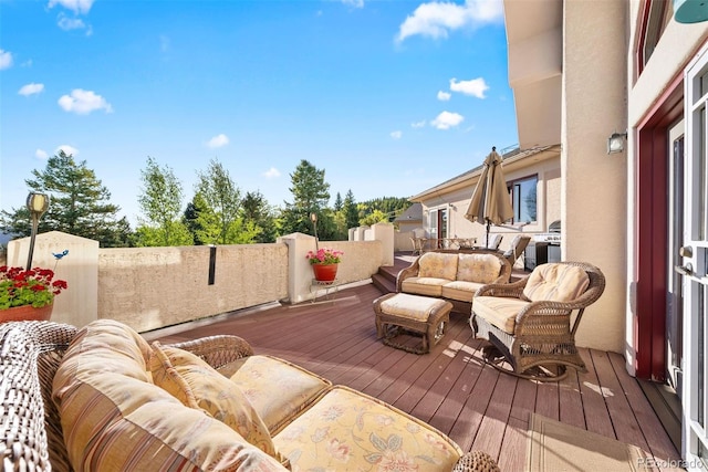 wooden deck with an outdoor living space