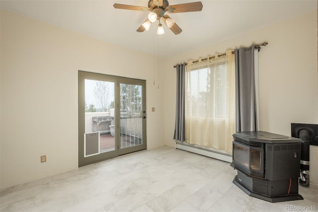 interior space with a ceiling fan, a wood stove, and baseboard heating
