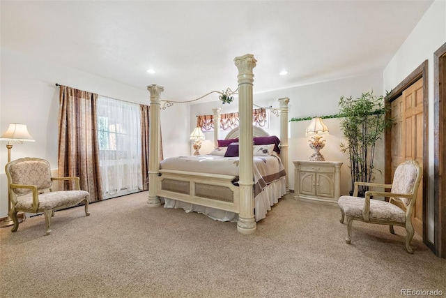bedroom with light colored carpet and recessed lighting
