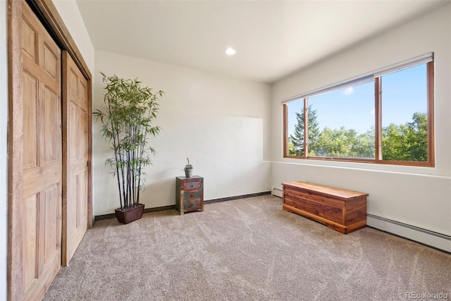 bedroom with recessed lighting, a baseboard radiator, carpet flooring, baseboard heating, and baseboards