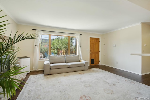 unfurnished living room with dark wood finished floors, crown molding, and baseboards