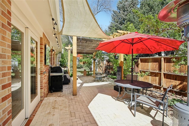 view of patio / terrace with outdoor dining space, a pergola, area for grilling, and fence