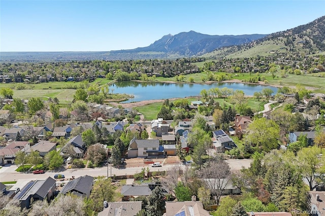 aerial perspective of suburban area featuring a water and mountain view