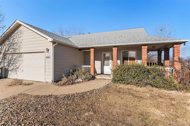 single story home with a garage and covered porch