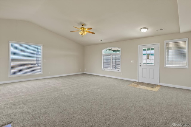 unfurnished room with carpet, lofted ceiling, and ceiling fan