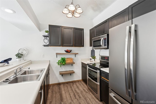 6447 Jonathan Ct, Colorado Springs, CO 80918 - kitchen with open shelves, a sink, light countertops, appliances with stainless steel finishes, and wood finished floors