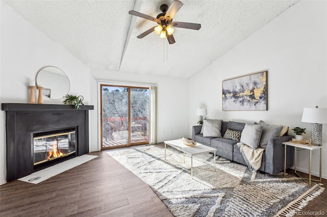 6447 Jonathan Ct, Colorado Springs, CO 80918 - living area with a fireplace with flush hearth, a textured ceiling, a ceiling fan, wood finished floors, and lofted ceiling