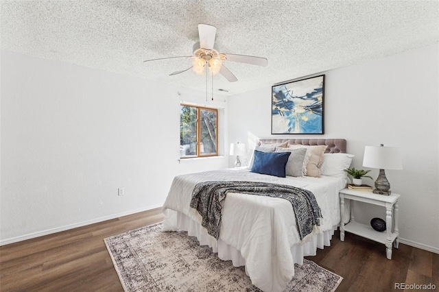6447 Jonathan Ct, Colorado Springs, CO 80918 - bedroom featuring ceiling fan, baseboards, wood finished floors, and a textured ceiling