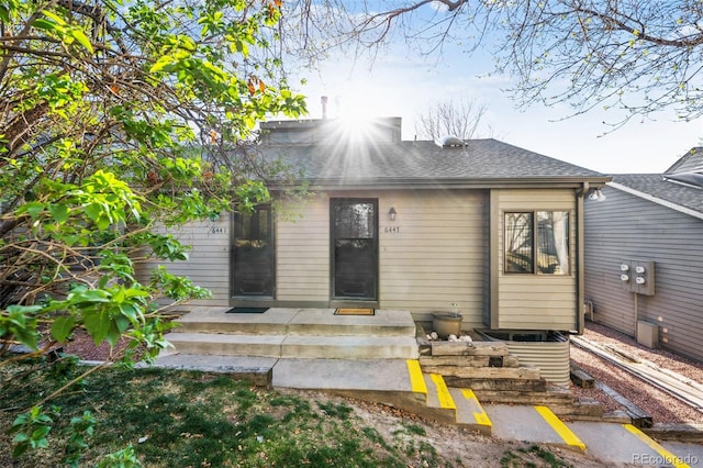 6447 Jonathan Ct, Colorado Springs, CO 80918 - back of property with roof with shingles
