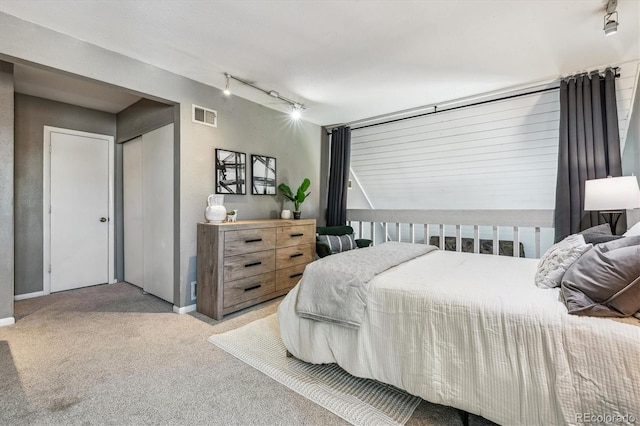 2491 S Xanadu Way Unit A, Aurora, CO 80014 - bedroom featuring track lighting, carpet, and baseboards