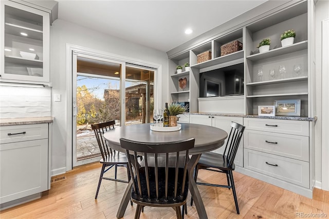 dining area with light hardwood / wood-style floors